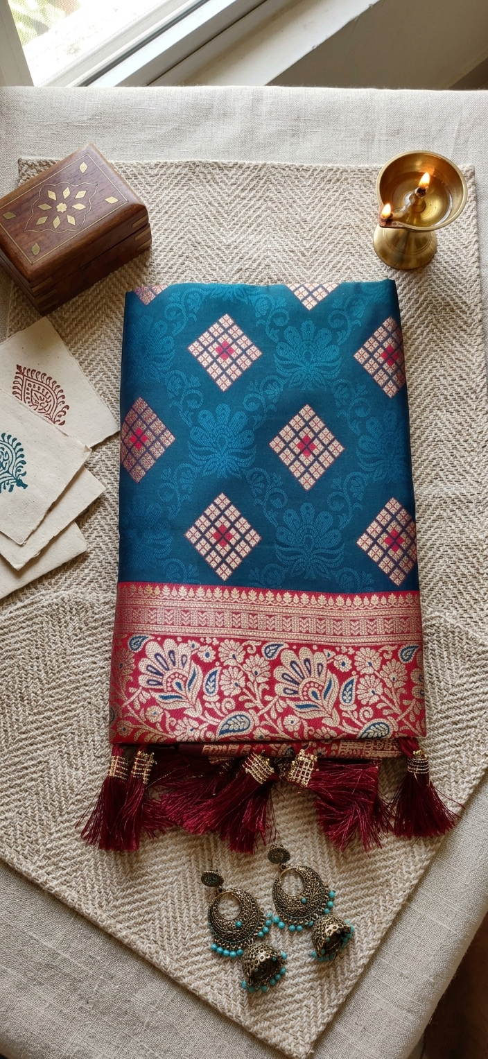 Teal Meenakari Silk Saree with Red Contrast Border & Tassels